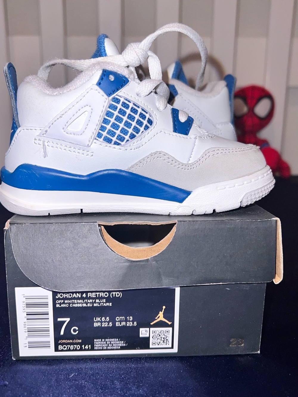 Jordan Retro 4 Low Top Sneakers in White & Blue | 7c